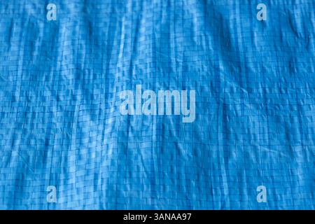 Blue industrial weatherproof tarpaulin sheet background backdrop. Industrial commercial heavy duty material Stock Photo