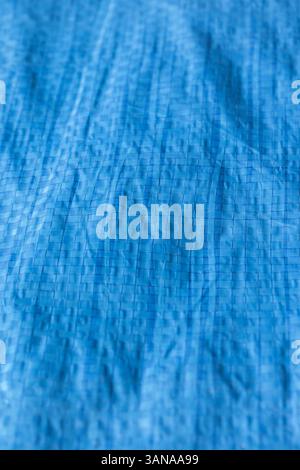 Blue industrial weatherproof tarpaulin sheet background backdrop. Industrial commercial heavy duty material Stock Photo