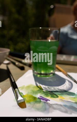 A mixture of paints and brushes for drawing, a watercolor palette Stock Photo