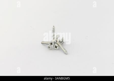 Mixed screws on white background with copy space Stock Photo