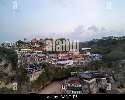 Aerial view of coastal buildings on a cliff overlooking the ocean, Uluwatu, Indonesia. Stock Photo