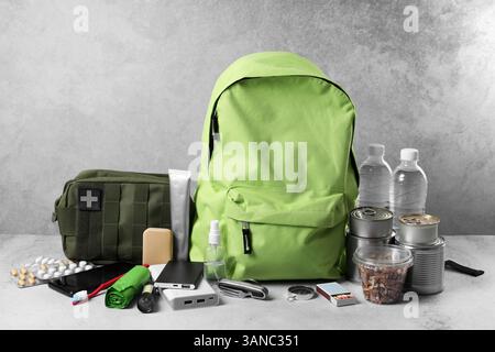 Survival kit. Different emergency supplies on light table Stock Photo