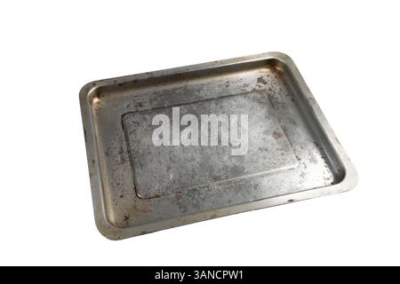 an old dirty and scratched saucepan on a transparent surface Stock Photo