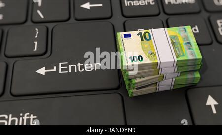 Euro notes lying on PC keyboard Stock Photo