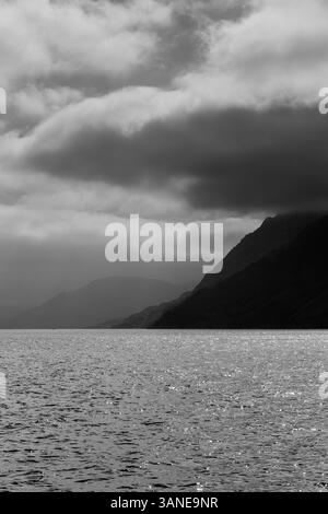 Dramatic stormy sea and thunderous sky with large waves crashing onto ...