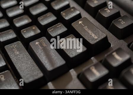 Keyboard for computer server or desktop computer focus on enter button on a keyboard in office, business and information technology concept Stock Photo