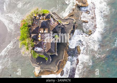 Aerial View worshippers in Tanah Lot temple in Bali, Indonesia. Stock Photo