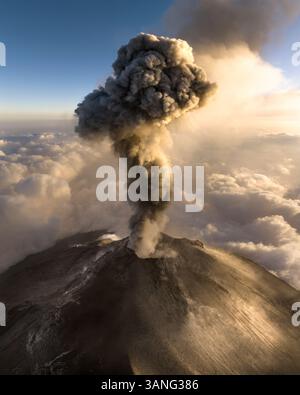 Aerial view of erupting Fuego volcano with smoke and explosion above ...