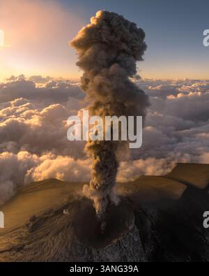 Aerial view of erupting Fuego volcano with smoke plume and dramatic ...
