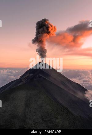 Aerial view of erupting Fuego volcano with smoke and ash clouds ...