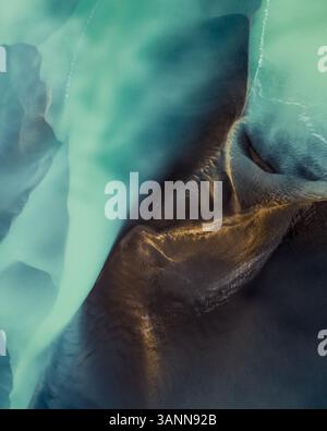 Aerial view of glacial river Olfusá coming down from the mountains to meet the ocean, Reykjanes Peninsula, Iceland. Stock Photo