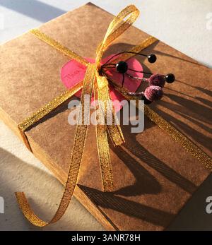 holiday gift box with ribbon on plain background top down view perfect for marketing or social media ads Stock Photo