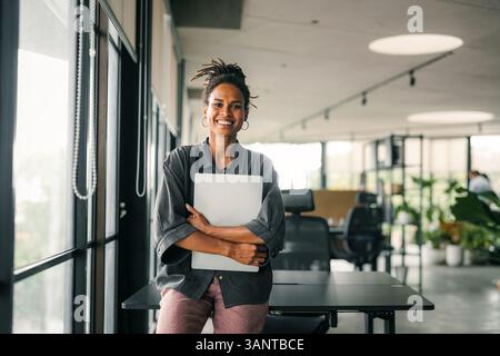 Portrait of a beautiful successful young business people software engineer with laptop in the office Stock Photo