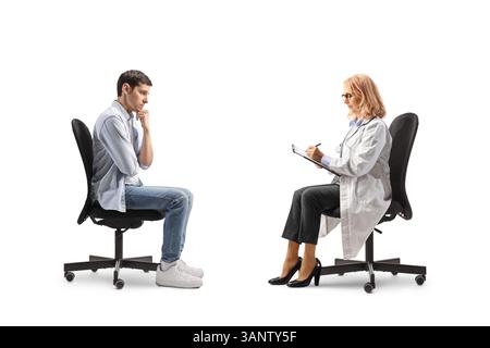 Pensive man sitting in a chair opposite a female doctor solated on white background Stock Photo