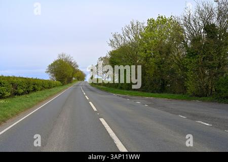 A361 country road going through Somerset countryside in early spring, UK Stock Photo