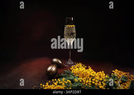 Elegant Easter composition with champagne and mimosa Stock Photo