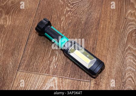 This is a durable and highly versatile LED flashlight that is ideal for camping, emergencies, and home use Stock Photo