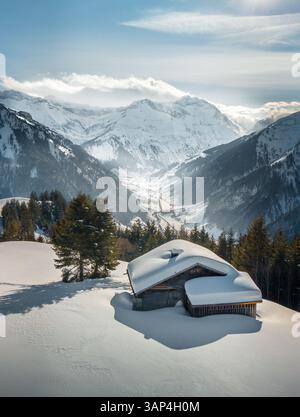 An aerial view of a hut in a snowy forest Stock Photo - Alamy