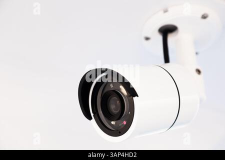 CCTV camera on the hull of an expensive motor yacht. CCTV camera white on a white body. Stock Photo