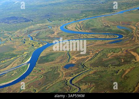 Aerial view of autumn Siberian Taiga with winding Ob River and pristine ...
