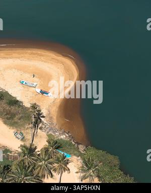 Aerial view of estuary with river Maha Oya flowing into Indian Ocean ...