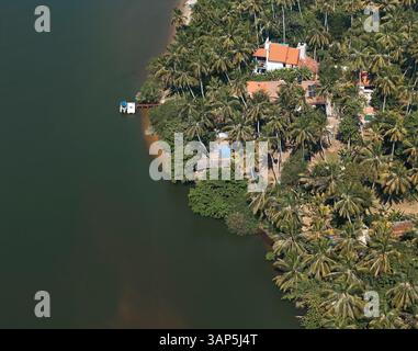 Aerial view of river Maha Oya, settlement, palm trees, bridge, Negombo ...