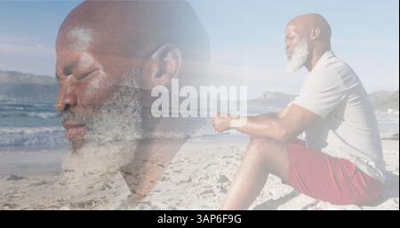 Composite of thoughtful african american senior man sitting on beach and looking out to sea Stock Photo