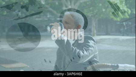 Financial data processing against senior businessman drinking coffee while sitting in corporate park Stock Photo