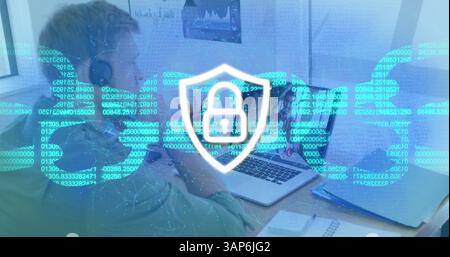 Image of online security padlock and chain over caucasian man using phone headset and laptop Stock Photo