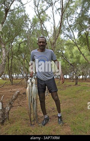 Rodrigues Octopus Mauritian man with an octopus, Rodrigues Island, Mauritius, Africa ...