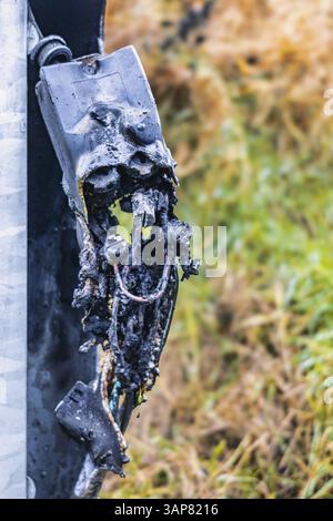 Short circuit in electrical system and its consequences Burnt cable junction box Stock Photo