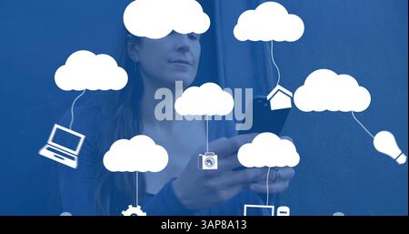 Image of digital clouds with icons over woman using smartphone Stock Photo