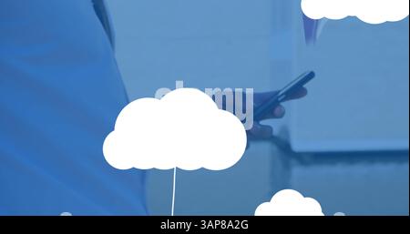 Image of digital clouds with icons over man using smartphone Stock Photo
