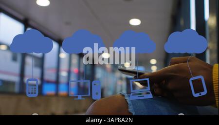 Image of digital clouds with icons over man using smartphone Stock Photo