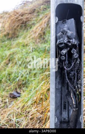 Short circuit in electrical system and its consequences Burnt cable junction box Stock Photo