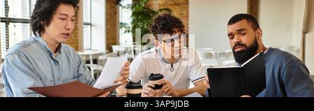Three people share ideas and coffee in a modern workspace. Stock Photo