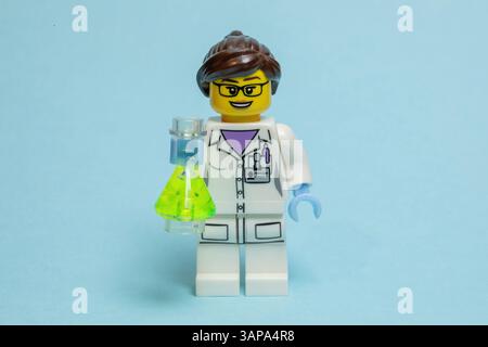 Toy model of a female scientist holding a beaker Stock Photo