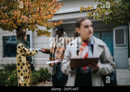 Collaborative Meeting Between Professionals Outdoors in an Urban Setting Stock Photo
