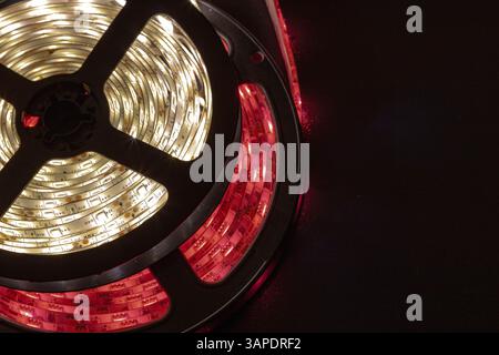 Close-up of coiled white and red LED strip lights Stock Photo
