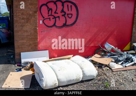Slough, UK. 16th April, 2025. llegal fly-tipping and rubbish dumped next to a closed down tyre repair premises in Cippenham Slough, Berkshire. DEFRA has recently published the Official Statistics for Fly-Tipping for the 2023/24 year. They said "Local authorities in England dealt with 1.15 million fly-tipping incidents, an increase of 6% from the 1.08 million reported in 2022/23. In 2023/24, 60% of fly-tips involved household waste. Total incidents involving household waste were 688,000 in 2023/24, an increase of 5% from 654,000 incidents in 2022/23. In Slough, compared to 2022-23, there has be Stock Photo