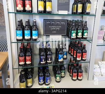 Bottles of beer brewed on the Dunham Massey Estate for sale in the shop at Dunham Massey Hall, Altrincham, Greater Manchester, Cheshire, England, UK Stock Photo