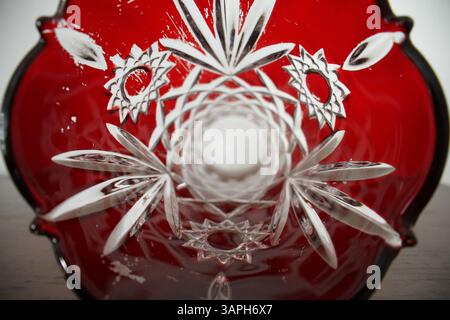 A closeup center view of a red colored vase, displays design on it. Stock Photo