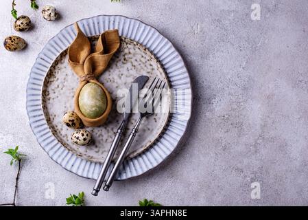 Elegant Easter table setting with painted egg Stock Photo