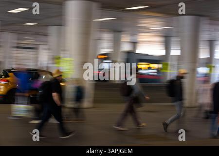 pedestrians walking through an underpass during rush hour, blurred motion, commuter Stock Photo