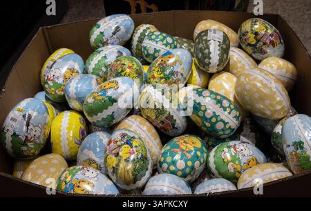 Colorful Easter eggs for sale. The eggs become gifts filled with sweets. Stock Photo