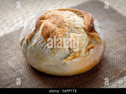 freshly baked bread on kitchen table Stock Photo