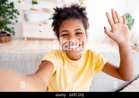 African kid girl waving hand video call remote learning on laptop ...