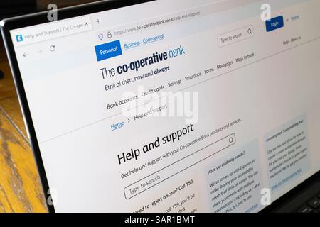 Co-operative bank help & support page on a laptop. Concept: support staff, account hacked, how can we help, customer service, complaints, complaining Stock Photo