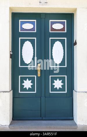 Green front door with shapes in white, painted, Kohren-Salis, district of Leipzig, Saxony, Germany, Europe Stock Photo