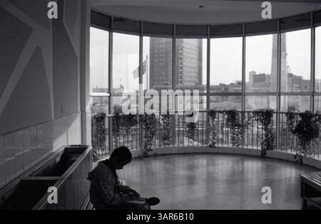 Student Sitting Alone in School Lobby - Victory Oilfield Elementary in Early 2000s China, Dongying, Shandong, China Stock Photo
